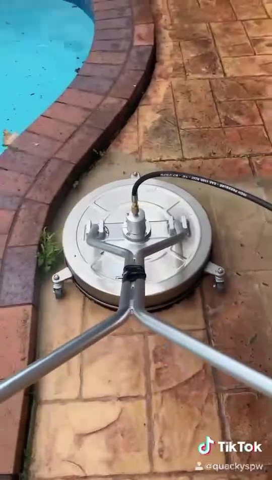 Pool surround being cleaned