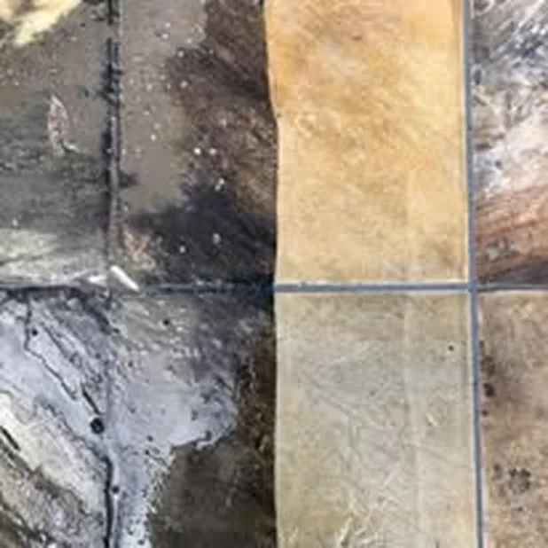 Patio tiles, weathered on the left, washed clean on the right